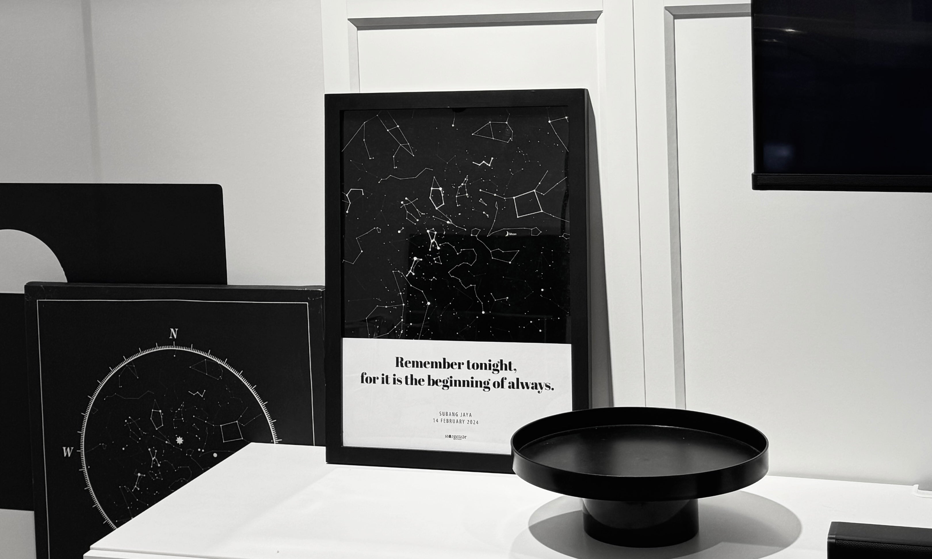 Framed custom Stargeizer A3 star map print with personalized text, displayed on a white surface.